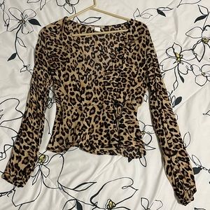 Cheetah print wrap around long sleeve shirt.